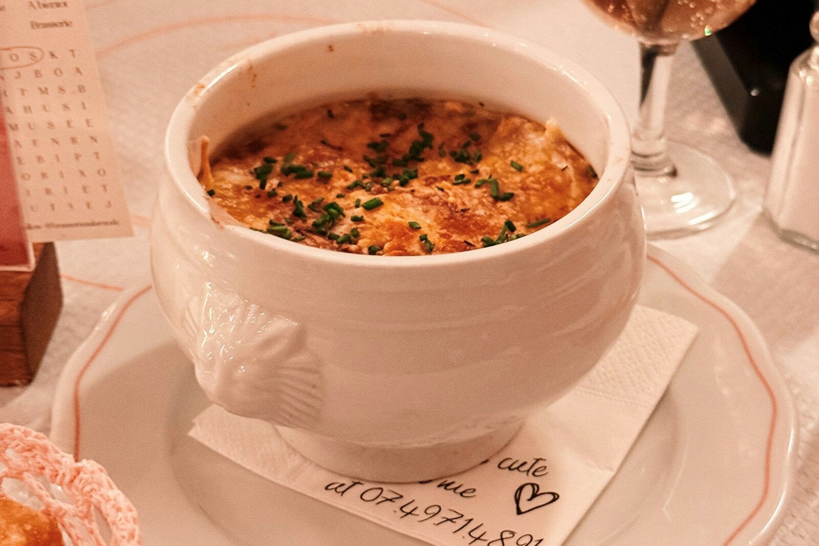 Classic French onion soup gratinée with bubbling Gruyère cheese top