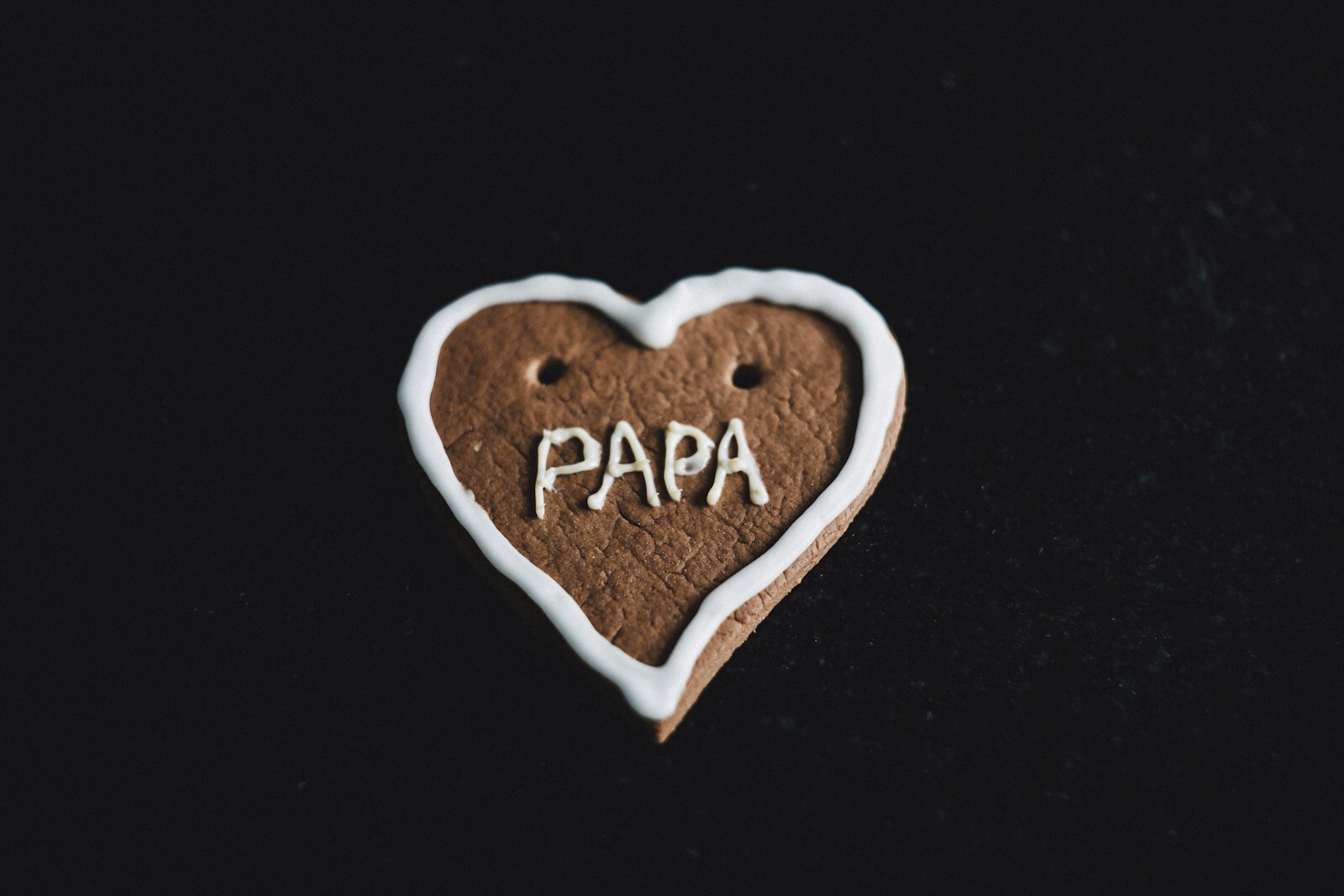 Heart-shaped sugar cookies with royal icing decoration