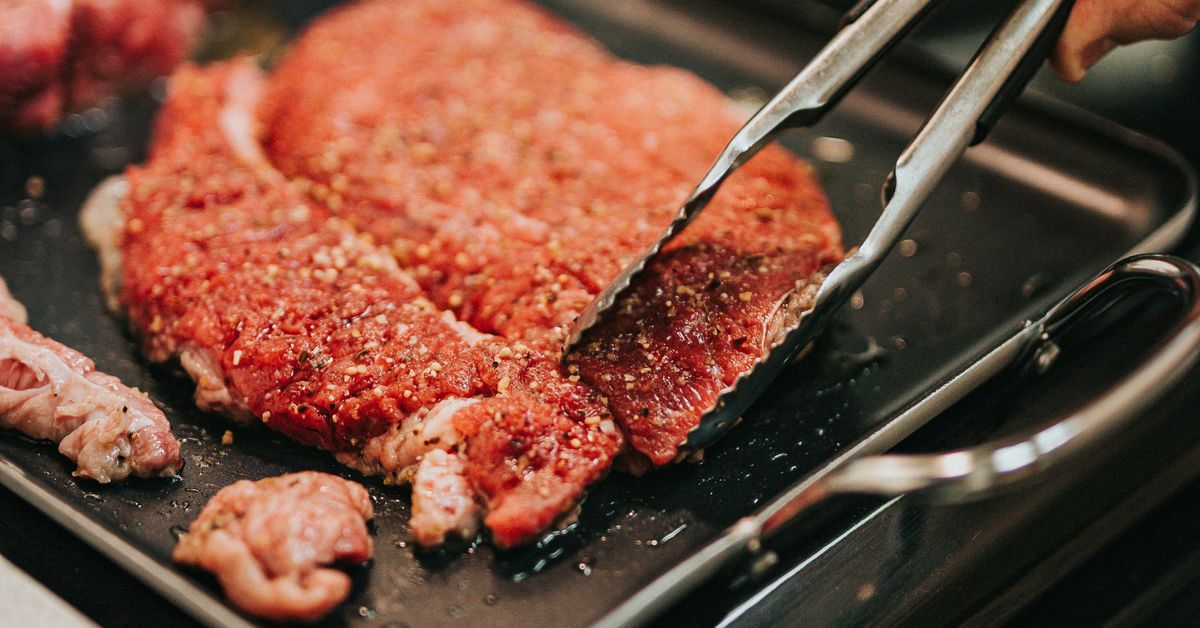 Pizza dough preparation with flour and ingredients on kitchen counter