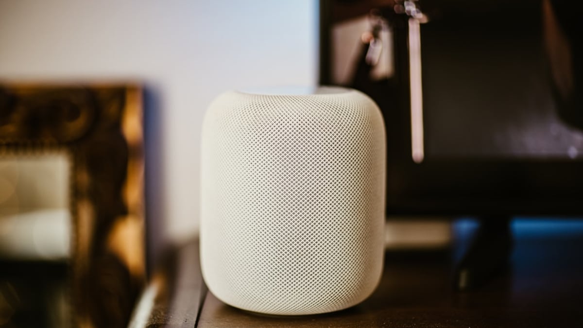 A beautifully crafted butter candle melting on a rustic wooden table, surrounded by slices of crusty bread and fresh herbs.