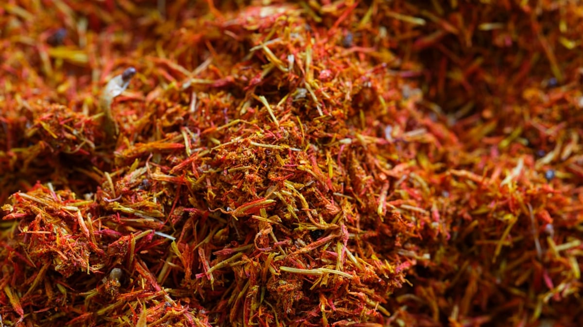 A colorful array of spices from around the world, arranged on a table.