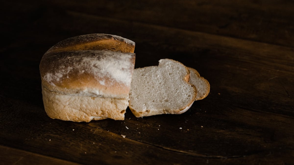 Close-up of a golden-brown loaf of freshly baked bread