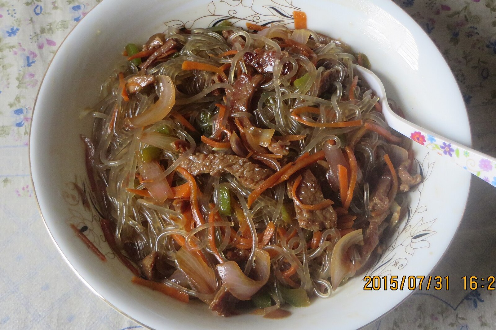 Korean japchae with glass noodles, beef, and stir-fried vegetables