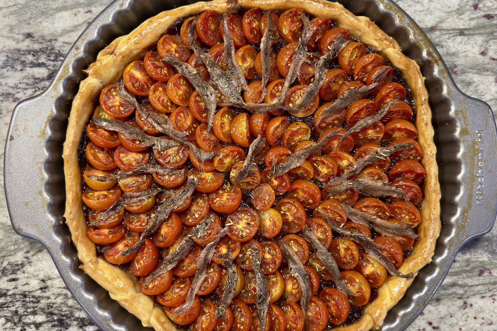 Provençal tomato tart with caramelized onions and Niçoise olives