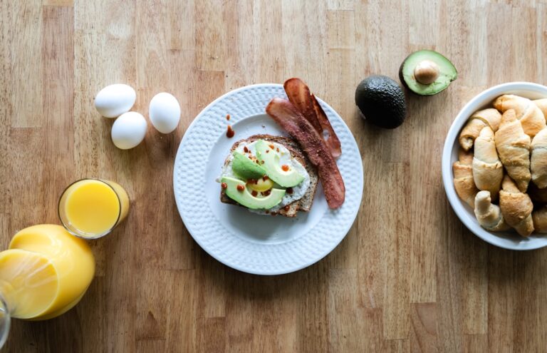 Golden toasted sourdough topped with mashed avocado, poached egg, and red pepper flakes