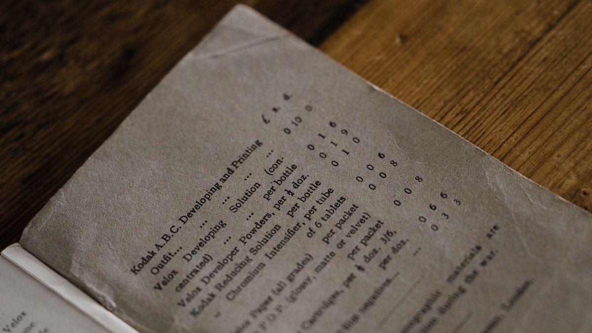 Printed recipe binder and cookbook on a kitchen counter with recipe cards, representing printable recipes for American home cooking classics