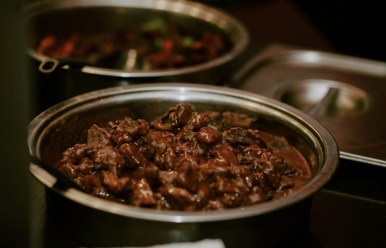 Beef bourguignon in a Dutch oven with red wine sauce