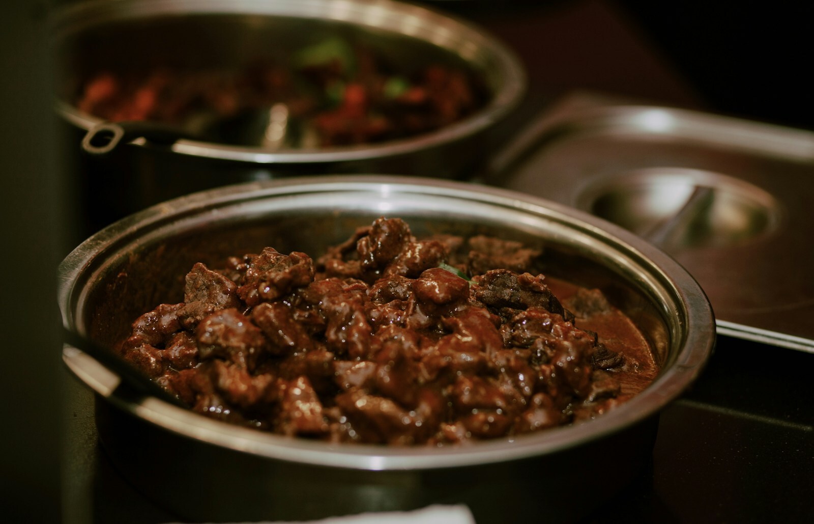 Beef bourguignon in a Dutch oven with red wine sauce