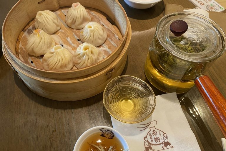 Shanghai xiaolongbao soup dumplings in a bamboo steamer