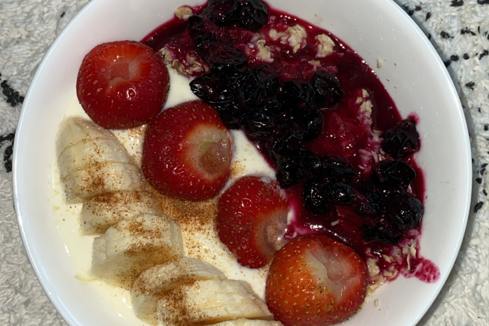 Mediterranean yogurt bowl with sweet cherries, honey drizzle, and crushed pistachios