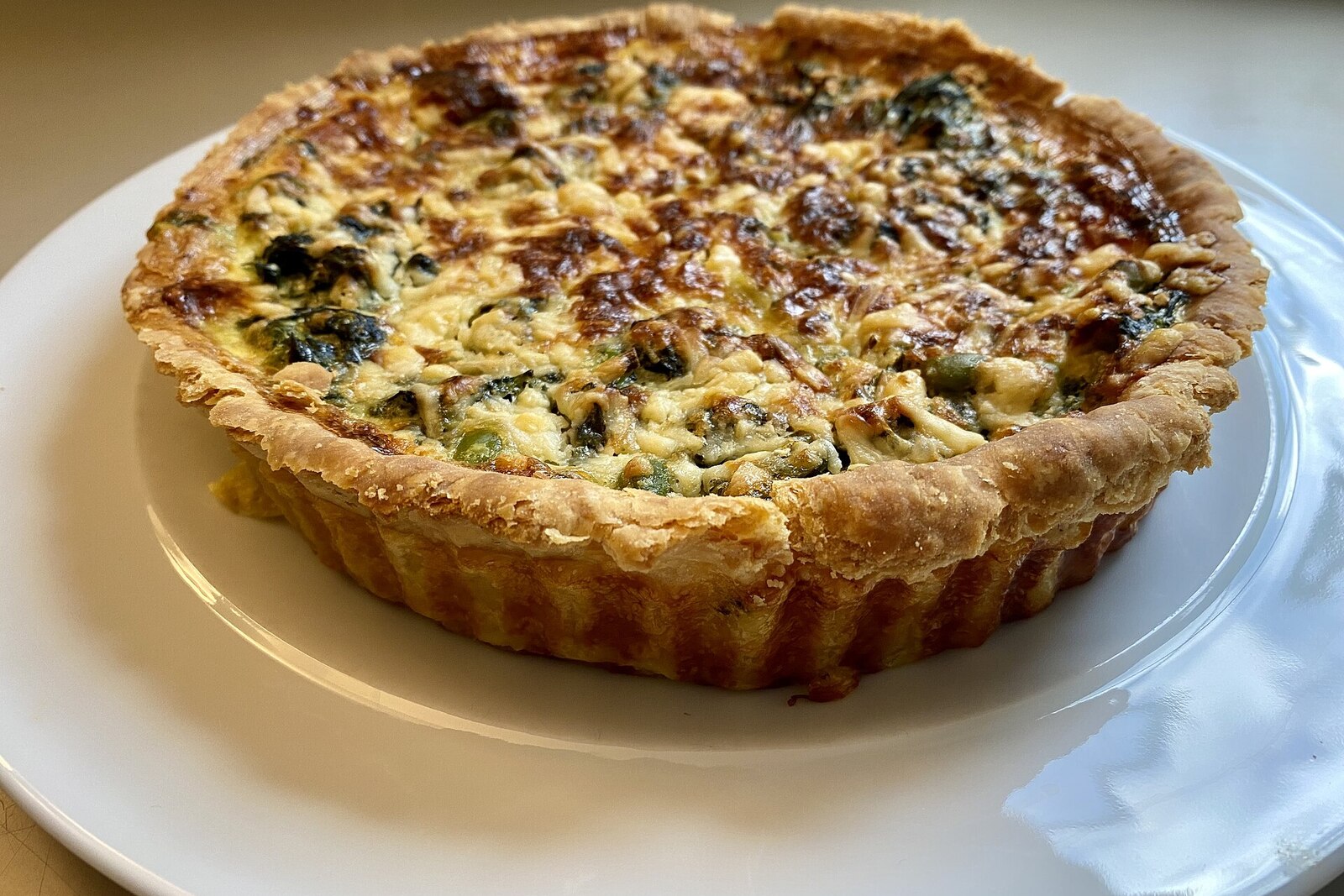 French quiche lorraine with golden brown crust and creamy egg-bacon filling