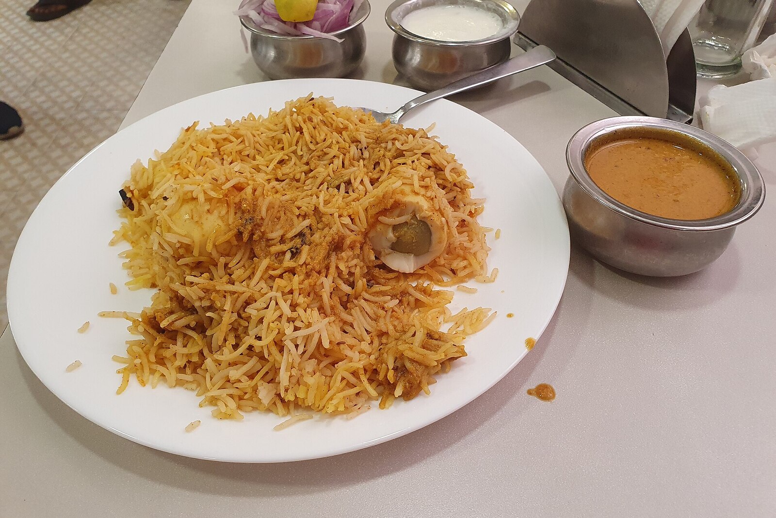 Hyderabadi lamb biryani with saffron rice and fried onions