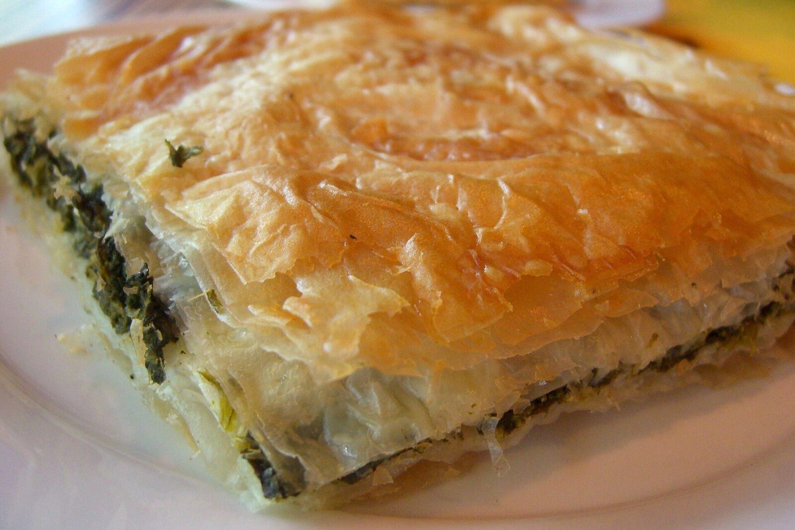 Greek spanakopita with golden phyllo layers and spinach feta filling