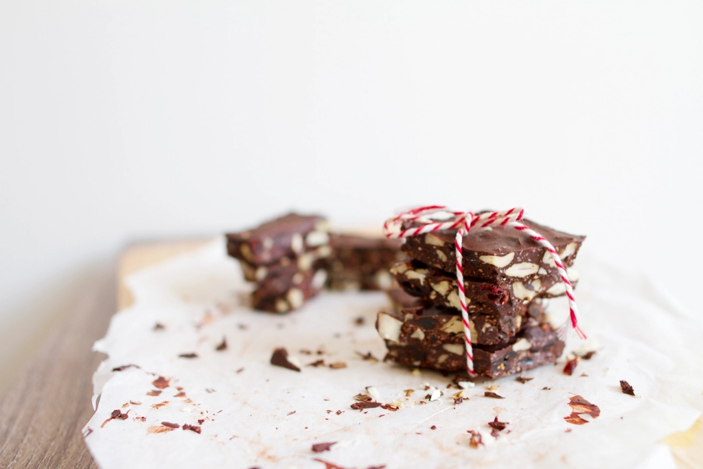 A sheet of chocolate bark studded with chopped colorful candy pieces